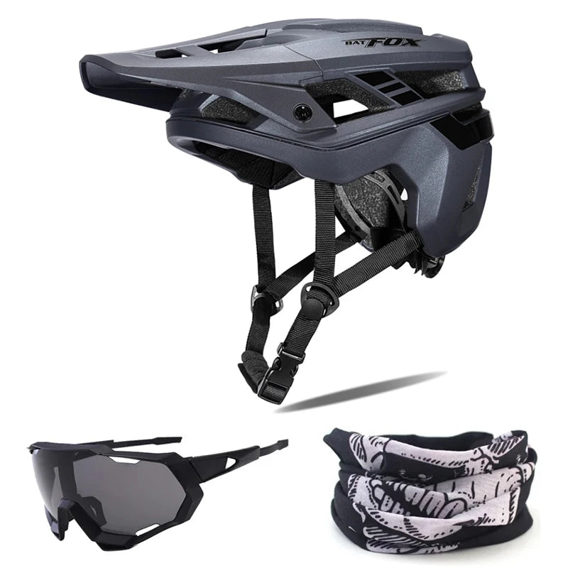 Black helmet with straps, black sunglasses, and black and white patterned neck gaiter on a white background